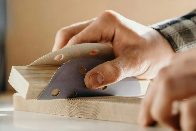 Woodworking and panel processing with abrasive rolls