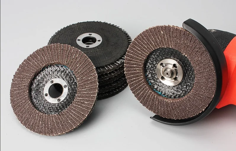 Industrial metal grinding workshop using flap discs