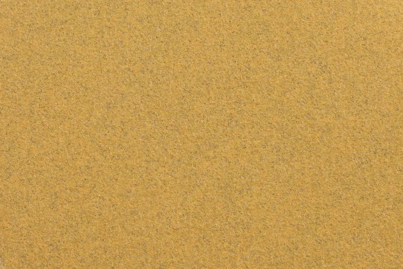Gold aluminum oxide sanding disc product image, white background, paper jumbo roll, industrial abrasive