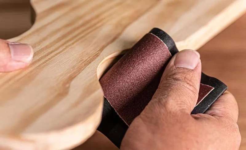 Line-side sanding in workshop using abrasive rolls