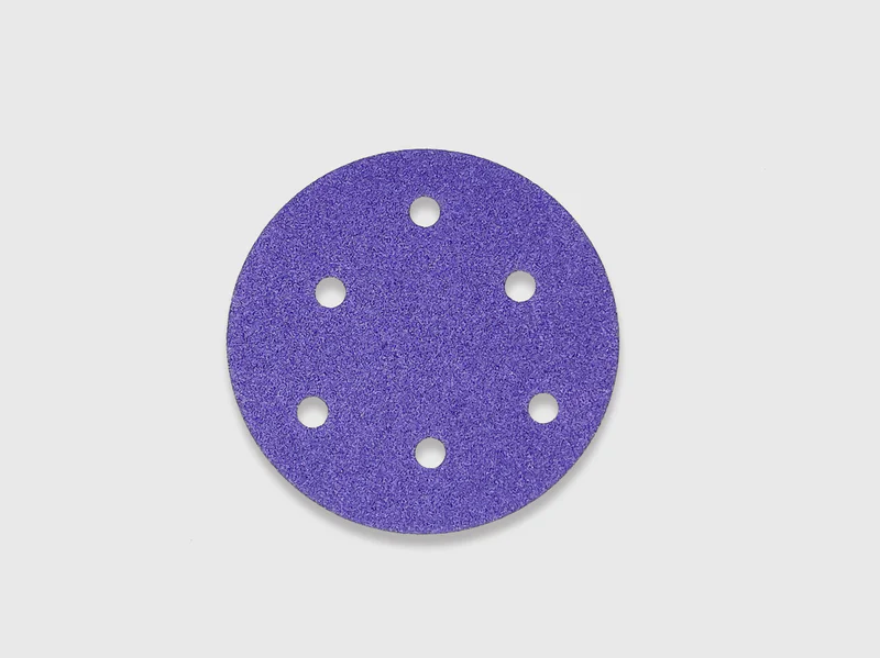 Purple sanding disc product image, zirconia alumina abrasive, multiple dust extraction holes, white background