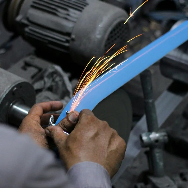 Cloth-backed abrasive belts for heavy-duty industrial grinding applications