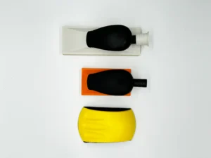 Product image of three sanding blocks with ergonomic handles, aluminum oxide abrasive, white background