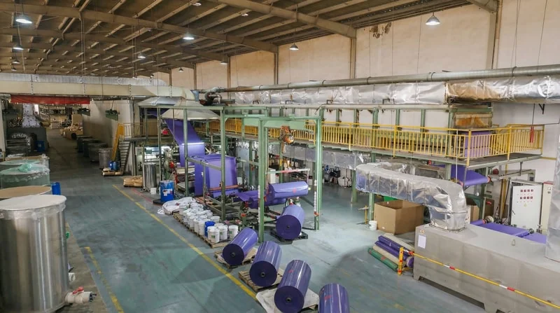 Abrasive jumbo roll manufacturing - coating process for film sanding discs