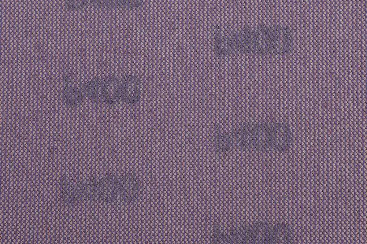 Mesh abrasive backing structure showing open weave pattern for dust extraction